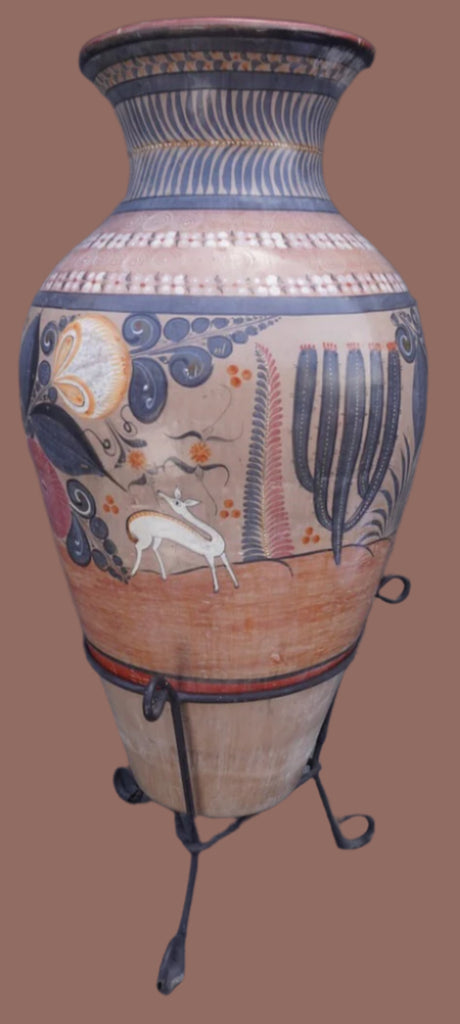Decorative vase with artistic designs on a stand against a brown background