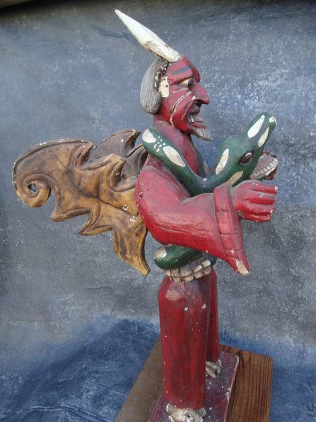 Winged Mexican Devil Wrapped in the Close Embrace of a Serpent Handcarved