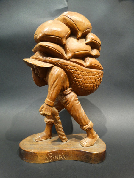 Jose Pinal (1913-1983) Woodcarving of Farmer Carrying Sacks of Grain 1930s-40s