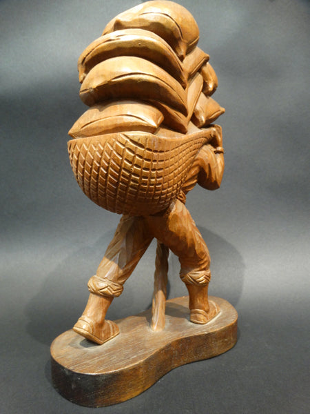 Jose Pinal (1913-1983) Woodcarving of Farmer Carrying Sacks of Grain 1930s-40s