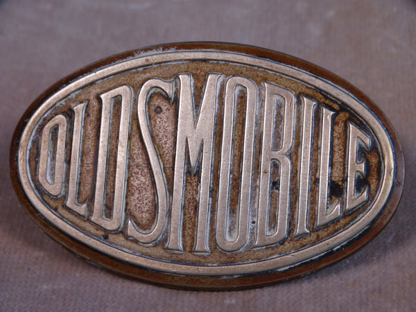 Oldsmobile Nickel & Brass Radiator Badge A2459