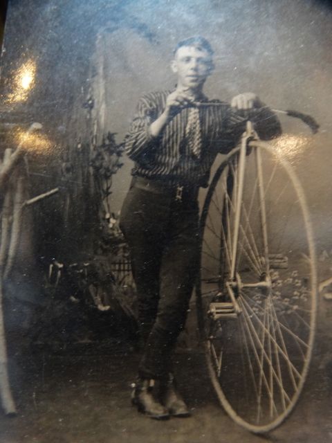 Vintage Photograph of a Young Man with a Bicycle