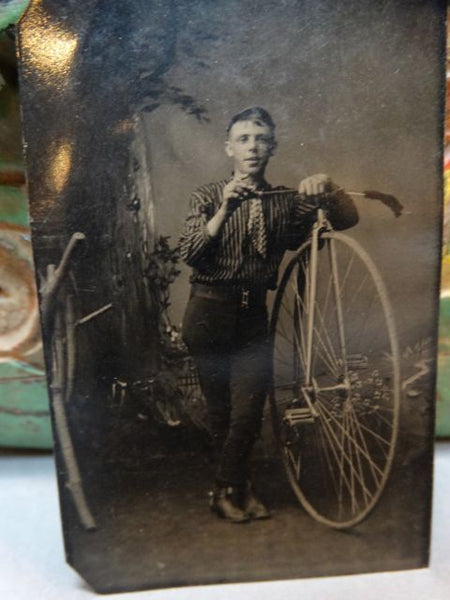 Vintage Photograph of a Young Man with a Bicycle