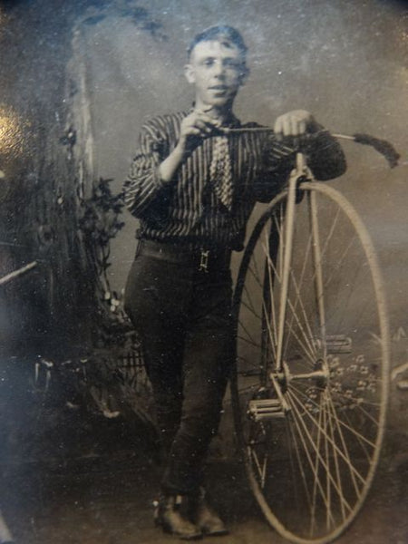 Vintage Photograph of a Young Man with a Bicycle