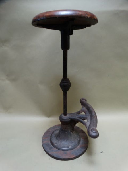Brown wood and iron stool