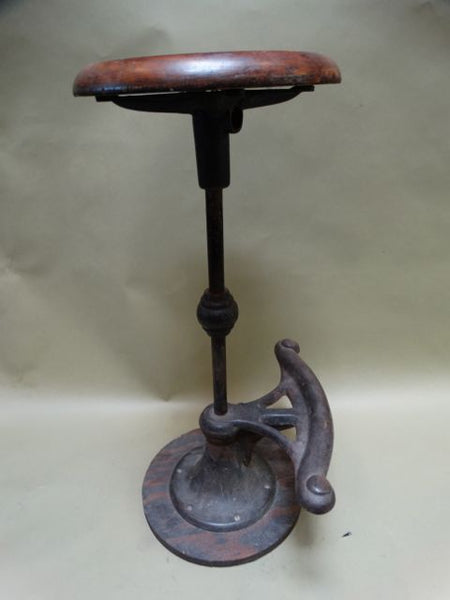 Brown wood and iron stool