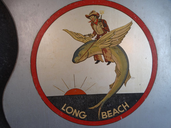 Folk Art Long Beach Shield - A Cowboy Riding a Flying Fish - 1930s P2670