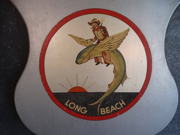 Folk Art Long Beach Shield - A Cowboy Riding a Flying Fish - 1930s P2670